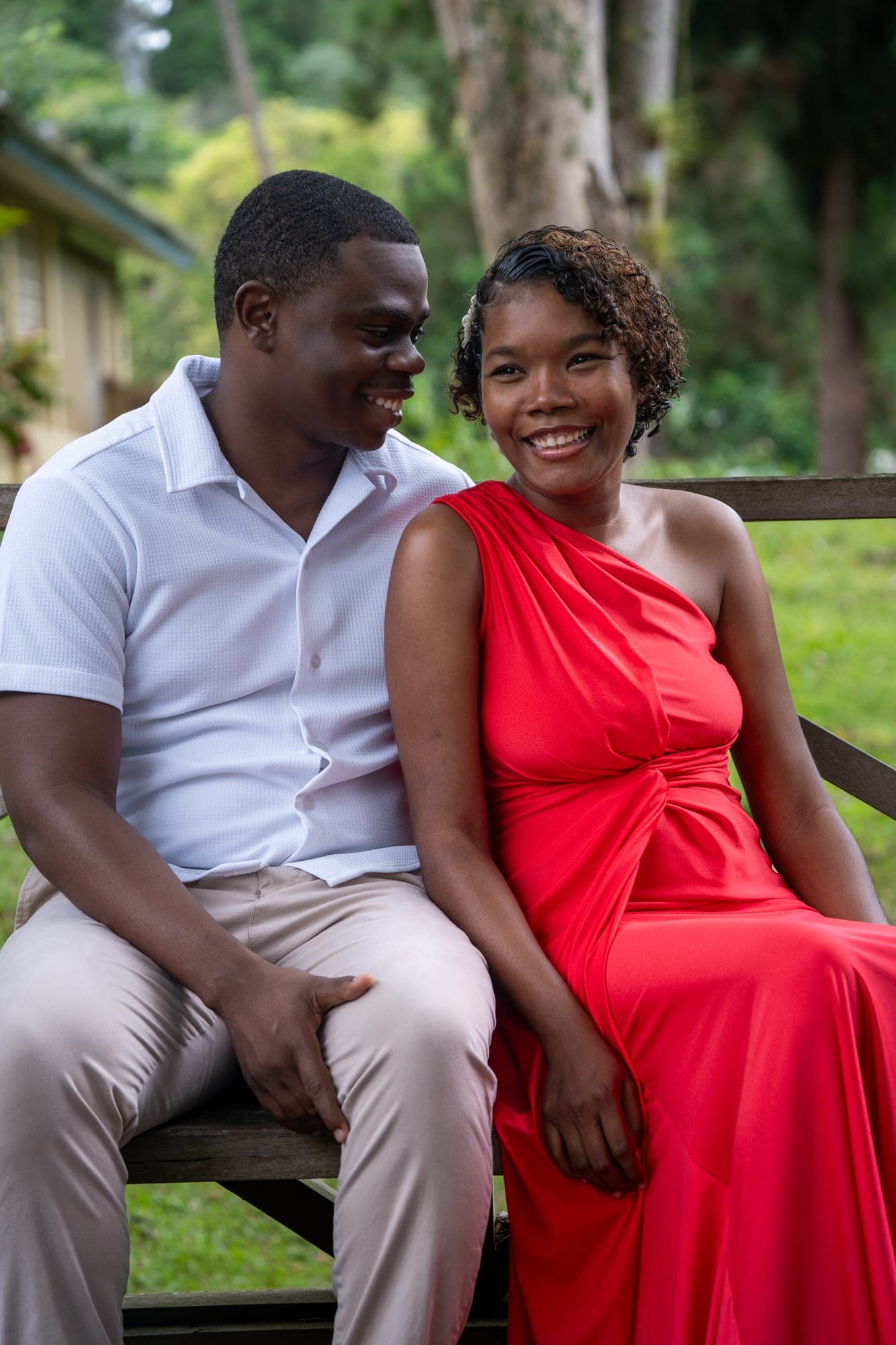 Don and Stevie-Ann seated close on a bench, smiling